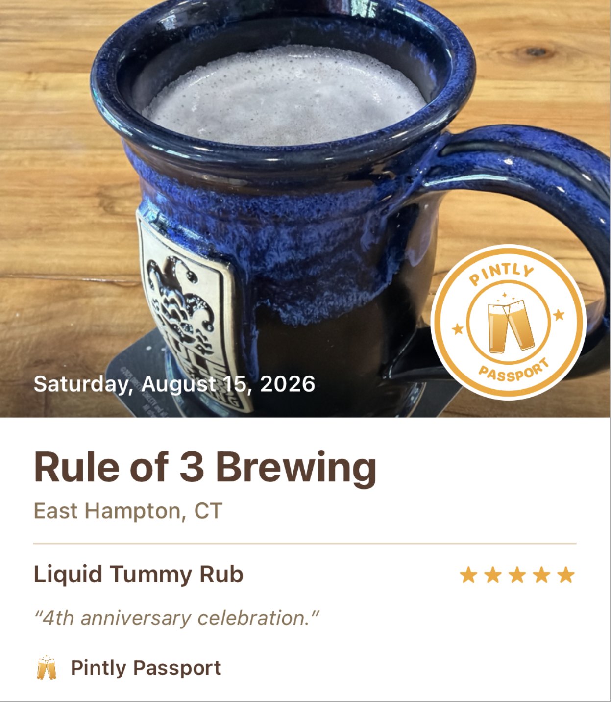 A shared visit card: a photo of a stoneware mug of beer dated Saturday, August 15, 2026, with a Pintly Passport seal, above the brewery name Rule of 3 Brewing in East Hampton, Connecticut, the beer Liquid Tummy Rub rated five stars, and the note "4th anniversary celebration."